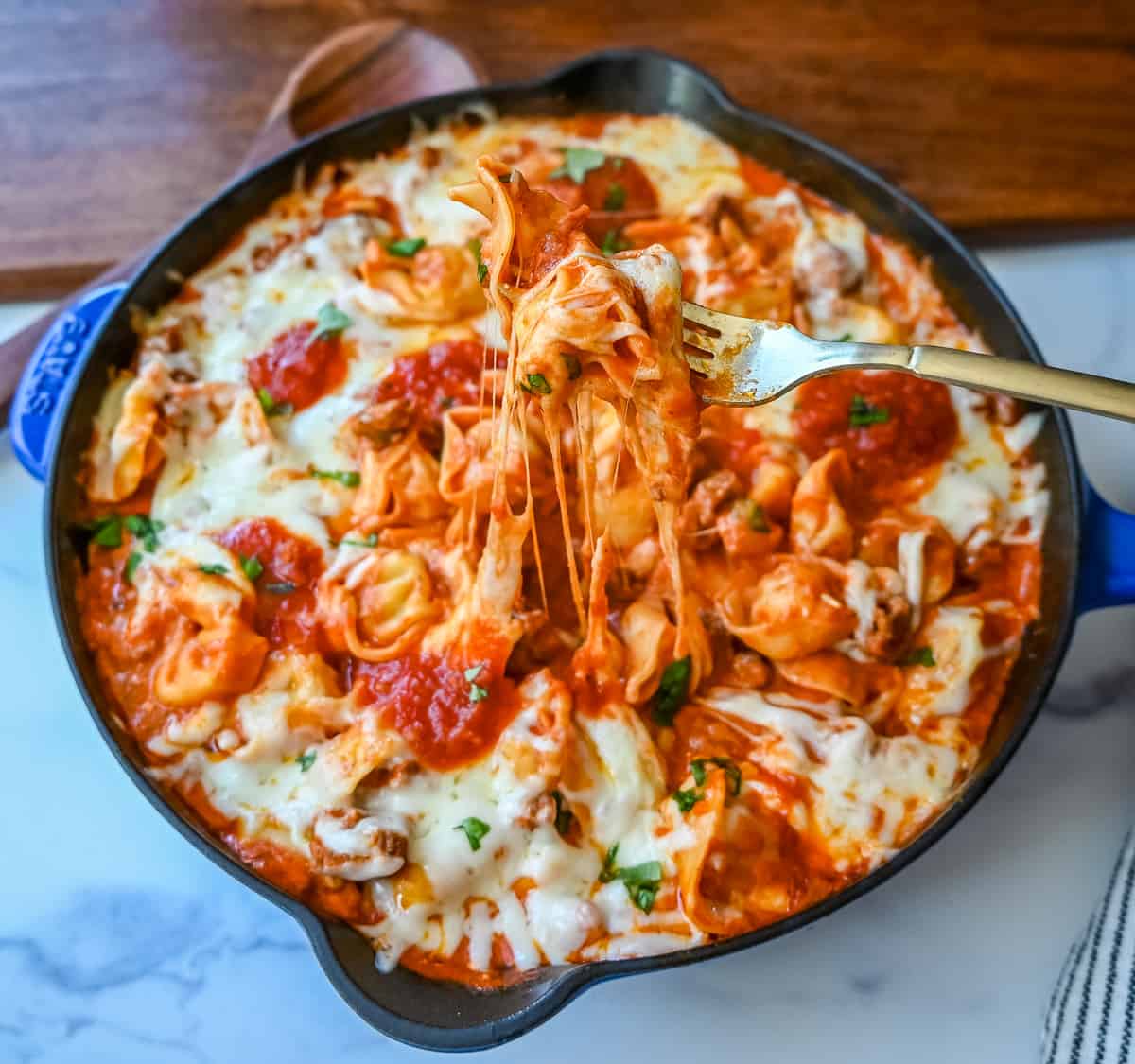 Cheese Tortellini with Sausage Ragu. This quick and easy 20 minute pasta bake is made with cheese tortellini in an Italian sausage ragu sauce and topped with cheesy melted mozzarella cheese. Everyone loves this easy pasta dinner made with only 5 ingredients!