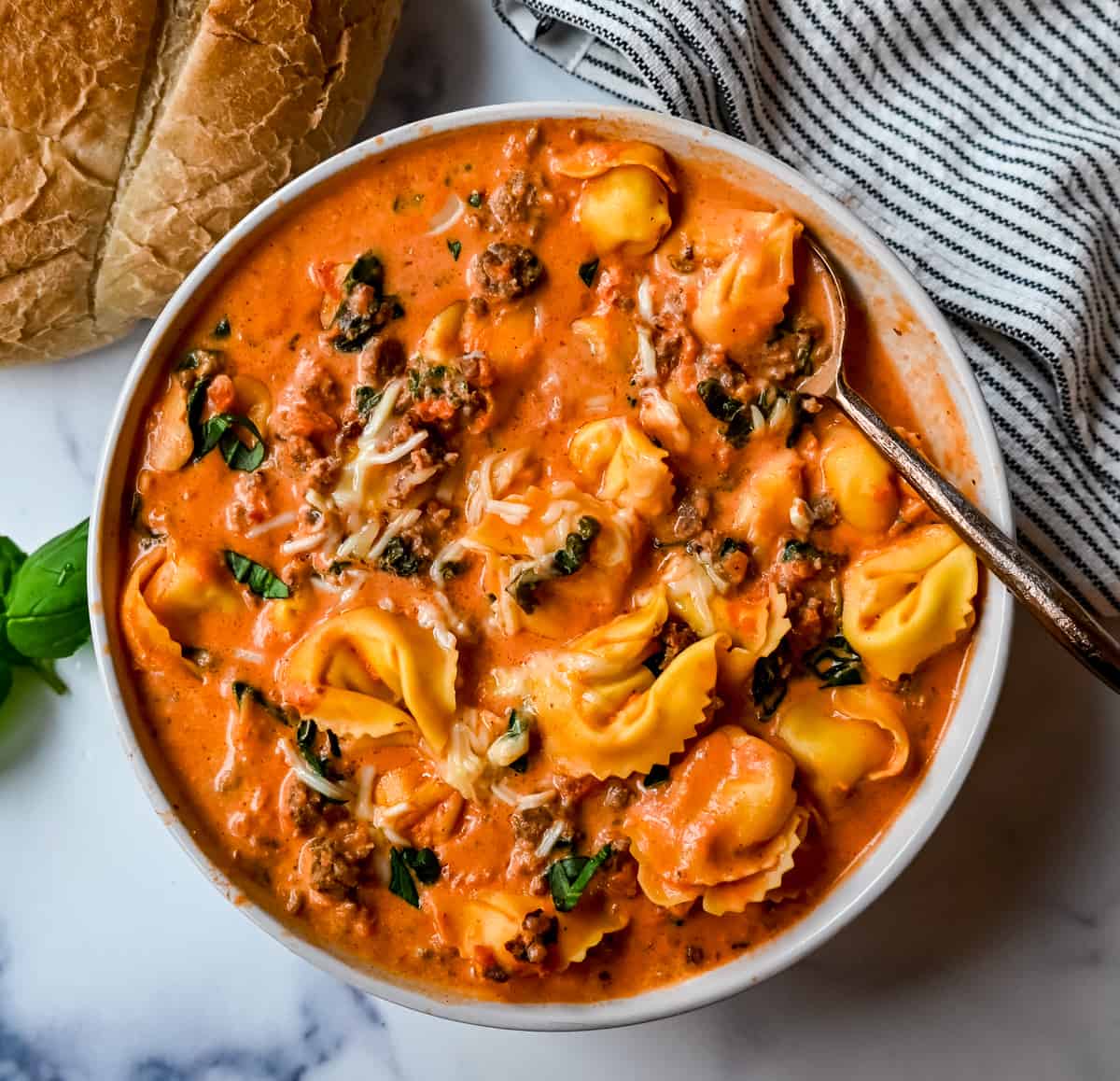 Creamy Sausage Tortellini Soup. An easy 6-ingredient Sausage Tortellini Soup is a family favorite. This popular soup recipe can be made on the stovetop or in a slow cooker. Rich, creamy, flavorful soup that everyone raves about! 
