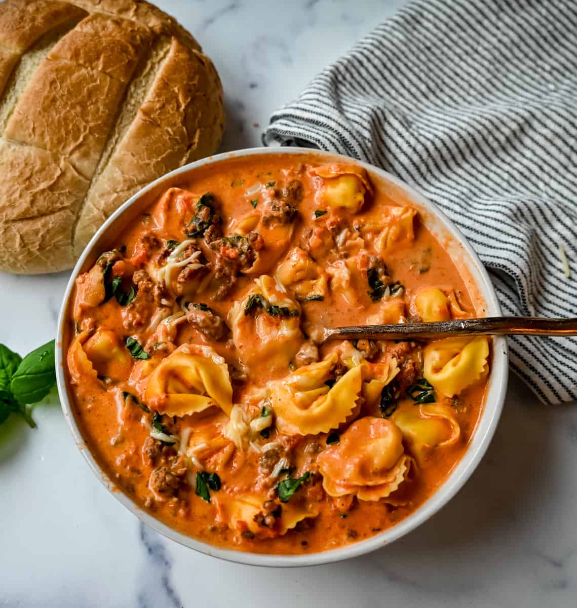 Creamy Sausage Tortellini Soup. An easy 6-ingredient Sausage Tortellini Soup is a family favorite. This popular soup recipe can be made on the stovetop or in a slow cooker. Rich, creamy, flavorful soup that everyone raves about!