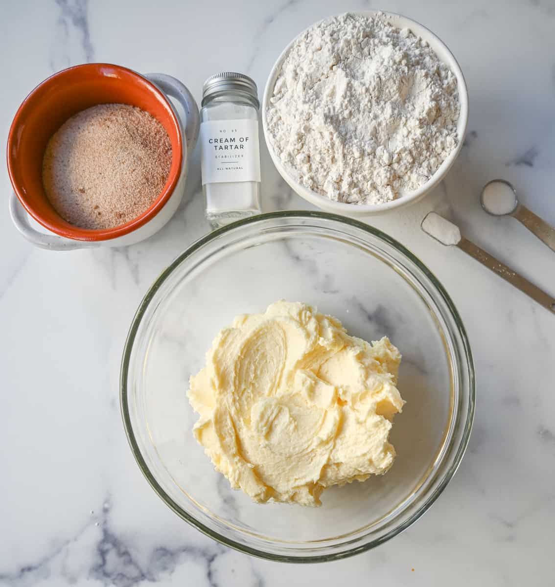 Making snickerdoodles and creaming together butter and sugar