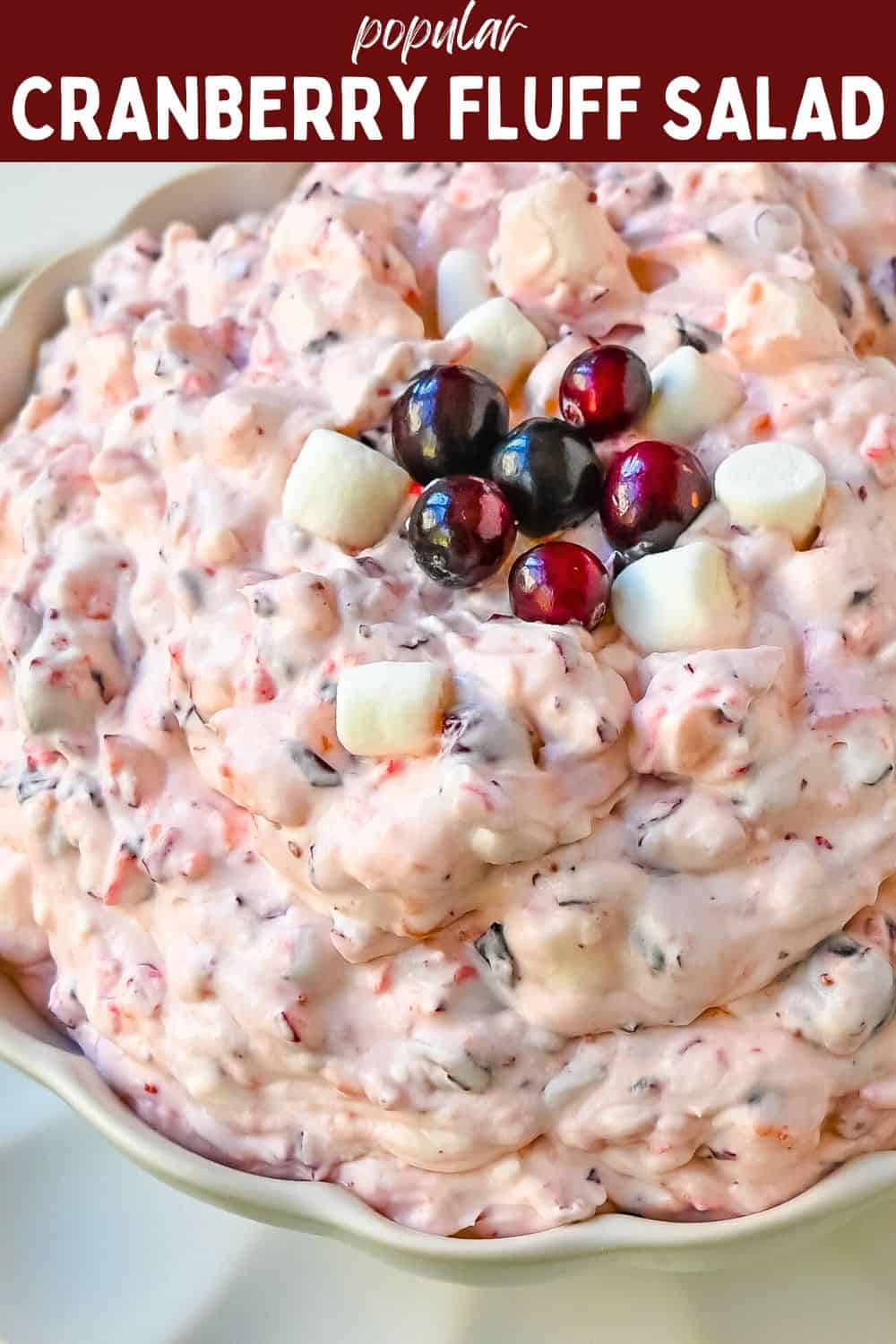 Cranberry Fluff Salad. This is such a popular holiday side dish! This easy cranberry salad is made with fresh cranberries, fresh pineapple, mini marshmallows, cream cheese, sugar, and fresh whipped cream. Perfectly sweet, tart, and creamy. This classic side dish recipe has been modernized and is better than ever!