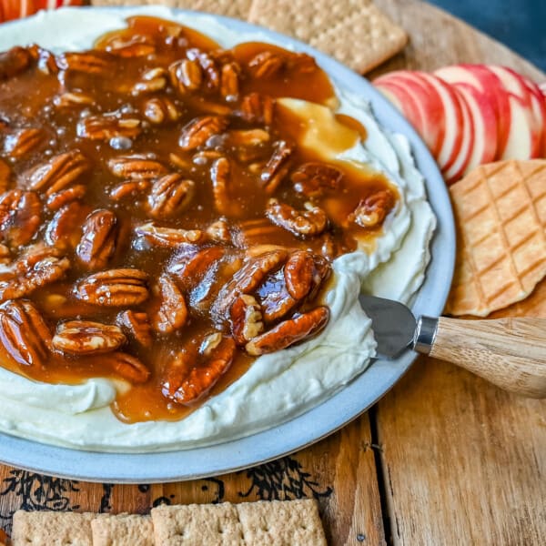 No Bake Pecan Pie Dip. This Pecan Pie Dip is made with creamy, fluffy, sweet cream cheese and whipped cream topped with a homemade pecan caramel sauce. This is all of the flavors of pecan pie without all of the work. A sweet and delicious holiday appetizer.