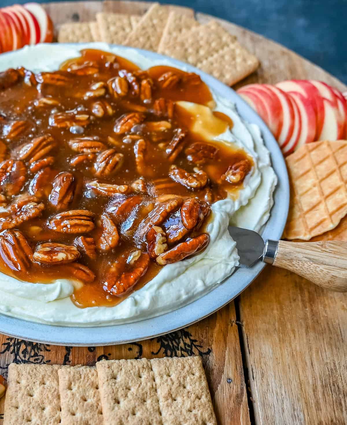 No Bake Pecan Pie Dip. This Pecan Pie Dip is made with creamy, fluffy, sweet cream cheese and whipped cream topped with a homemade pecan caramel sauce. This is all of the flavors of pecan pie without all of the work. A sweet and delicious holiday appetizer.