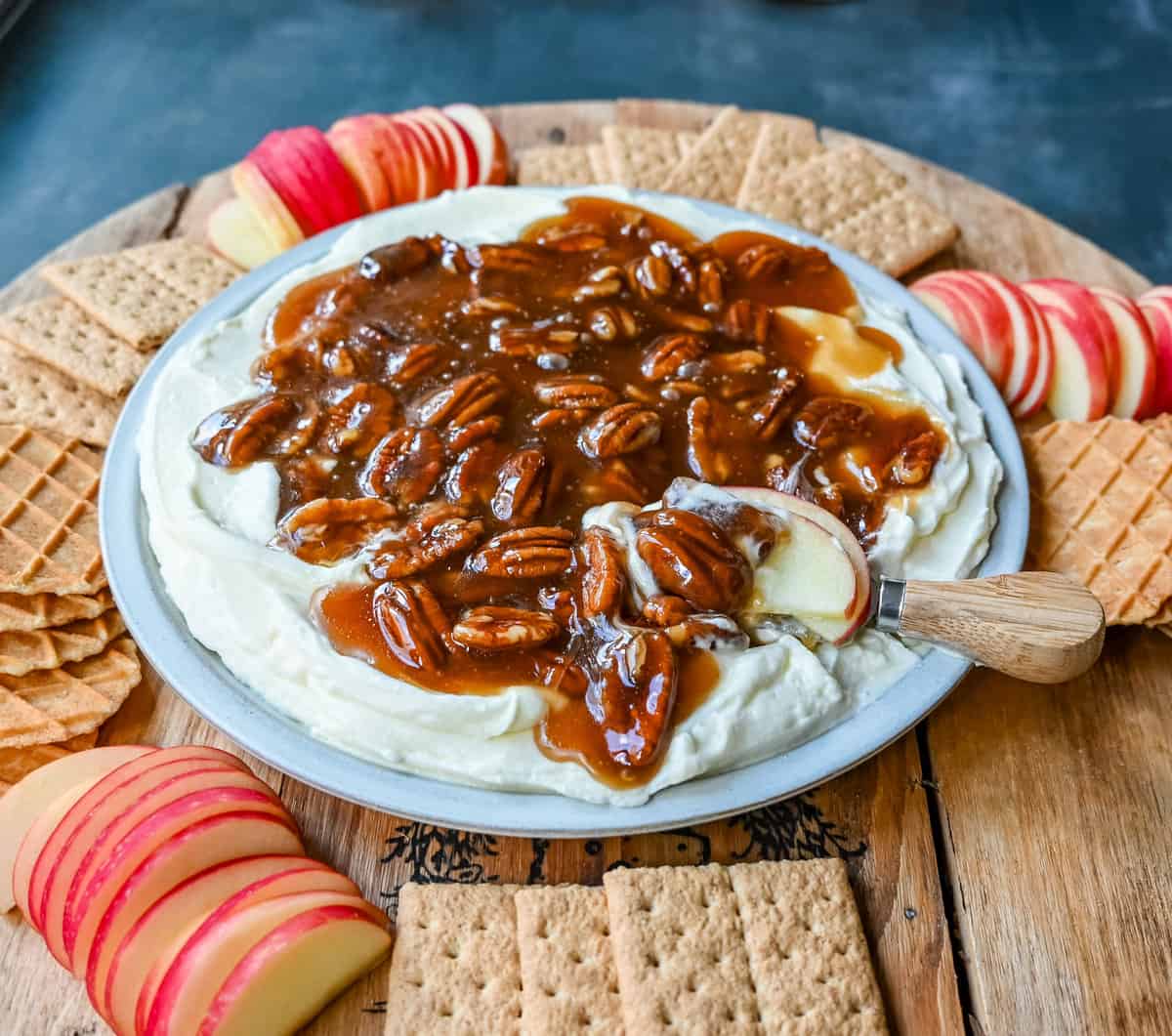 No Bake Pecan Pie Dip. This Pecan Pie Dip is made with creamy, fluffy, sweet cream cheese and whipped cream topped with a homemade pecan caramel sauce. This is all of the flavors of pecan pie without all of the work. A sweet and delicious holiday appetizer.