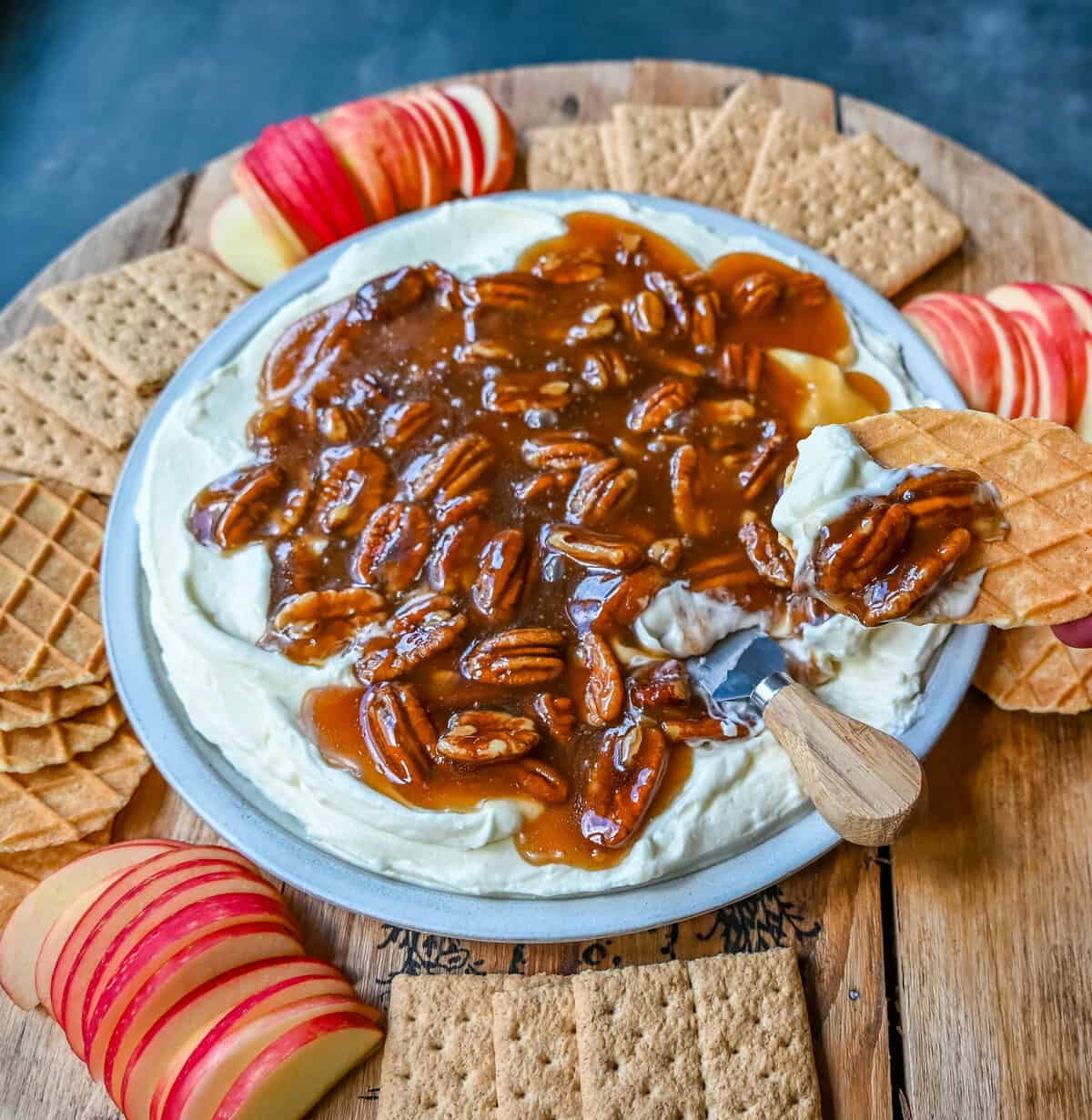 No Bake Pecan Pie Dip. This Pecan Pie Dip is made with creamy, fluffy, sweet cream cheese and whipped cream topped with a homemade pecan caramel sauce. This is all of the flavors of pecan pie without all of the work. A sweet and delicious holiday appetizer.