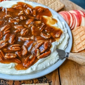 No Bake Pecan Pie Dip. This Pecan Pie Dip is made with creamy, fluffy, sweet cream cheese and whipped cream topped with a homemade pecan caramel sauce. This is all of the flavors of pecan pie without all of the work. A sweet and delicious holiday appetizer.