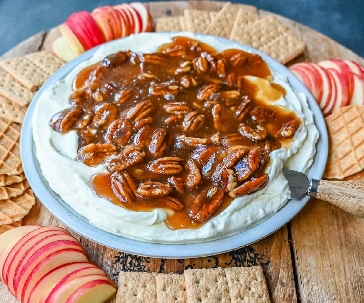 No Bake Pecan Pie Dip. This Pecan Pie Dip is made with creamy, fluffy, sweet cream cheese and whipped cream topped with a homemade pecan caramel sauce. This is all of the flavors of pecan pie without all of the work. A sweet and delicious holiday appetizer.