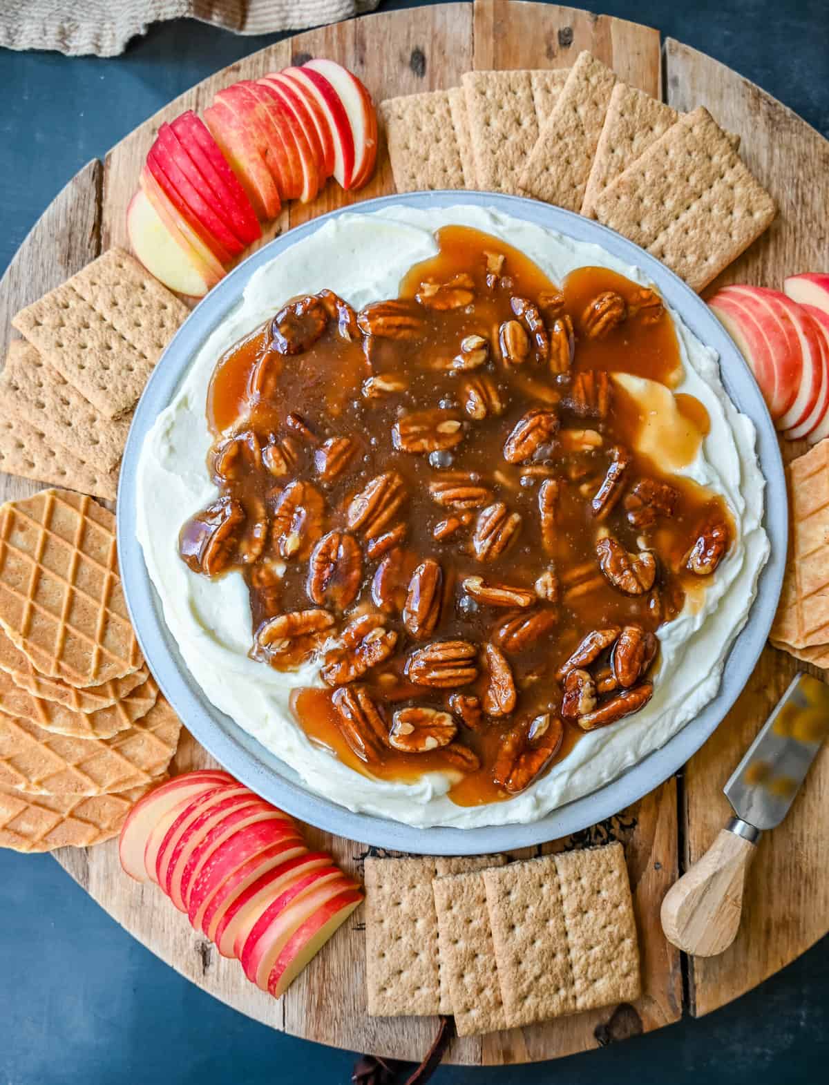 No Bake Pecan Pie Dip. This Pecan Pie Dip is made with creamy, fluffy, sweet cream cheese and whipped cream topped with a homemade pecan caramel sauce. This is all of the flavors of pecan pie without all of the work. A sweet and delicious holiday appetizer.