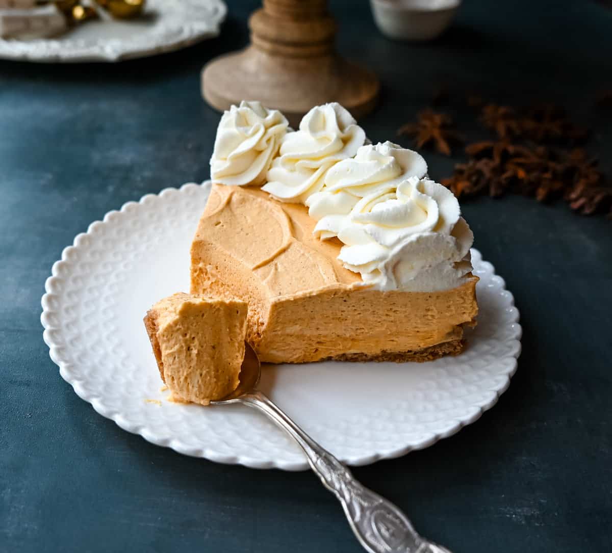 No-Bake Pumpkin Cheesecake. Creamy, smooth pumpkin cheesecake filling in a buttery graham cracker crust topped with whipped cream. This easy, no-bake dessert is perfect for Fall or Thanksgiving gatherings.