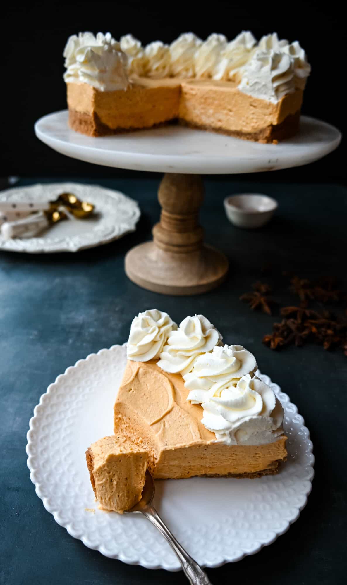 No-Bake Pumpkin Cheesecake. Creamy, smooth pumpkin cheesecake filling in a buttery graham cracker crust topped with whipped cream. This easy, no-bake dessert is perfect for Fall or Thanksgiving gatherings.