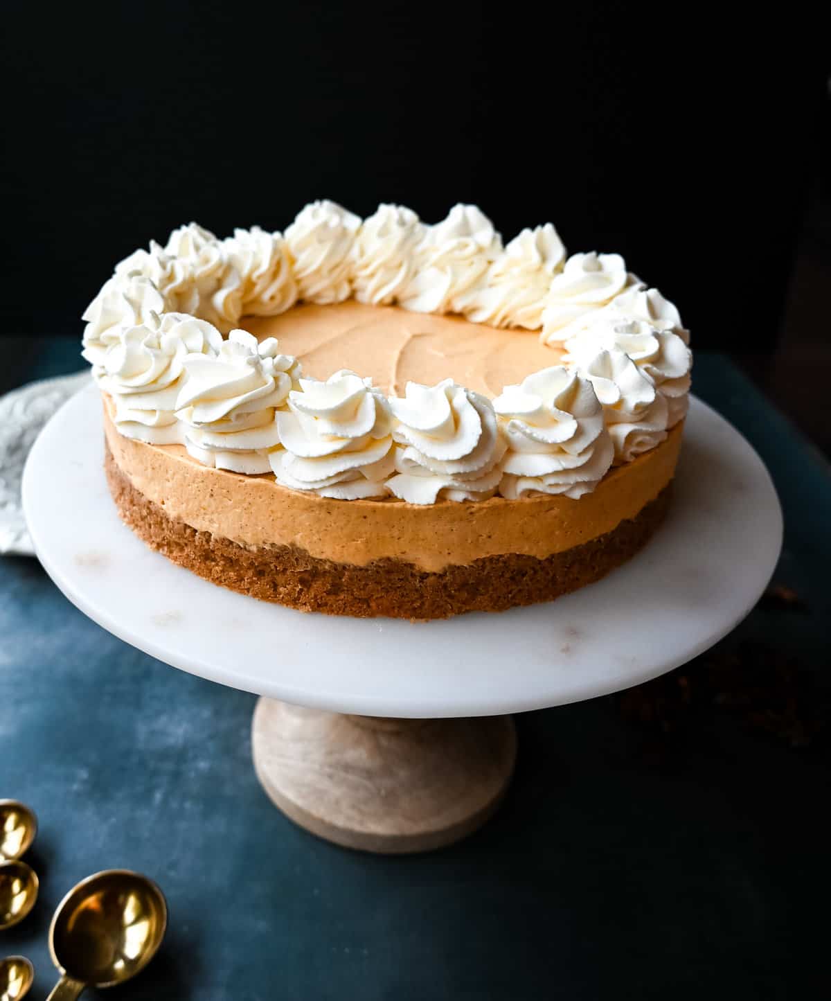 No-Bake Pumpkin Cheesecake. Creamy, smooth pumpkin cheesecake filling in a buttery graham cracker crust topped with whipped cream. This easy, no-bake dessert is perfect for Fall or Thanksgiving gatherings.