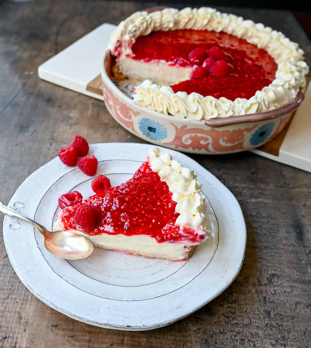 This Homemade Raspberry Cream Pie is made with a sweet luscious cream cheese filling and topped with a homemade raspberry sauce all in a homemade crust. This No-Bake Raspberry Cream Cheese Pie will become one of your absolute favorites!