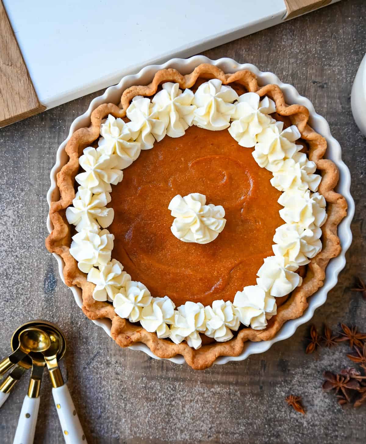 This Southern Sweet Potato Pie has the creamiest, spiced brown sugar sweet potato filling in a buttery crust and topped with fresh whipped cream. This is the perfect Fall and Thanksgiving dessert.