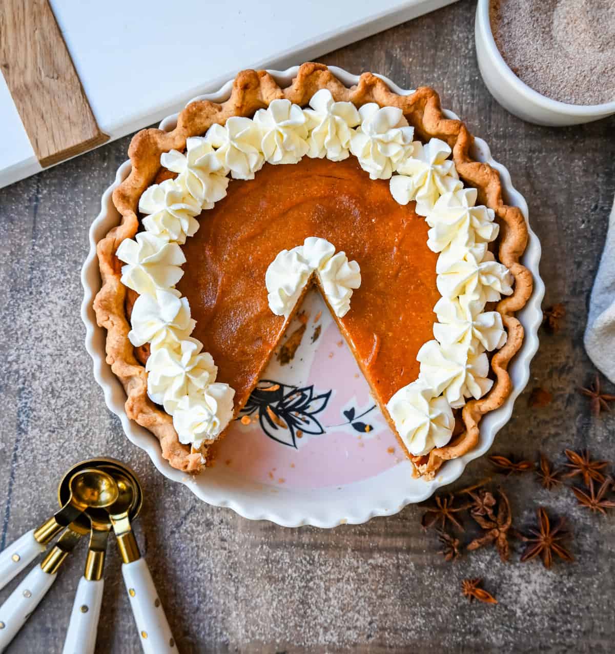 This Southern Sweet Potato Pie has the creamiest, spiced brown sugar sweet potato filling in a buttery crust and topped with fresh whipped cream. This is the perfect Fall and Thanksgiving dessert.