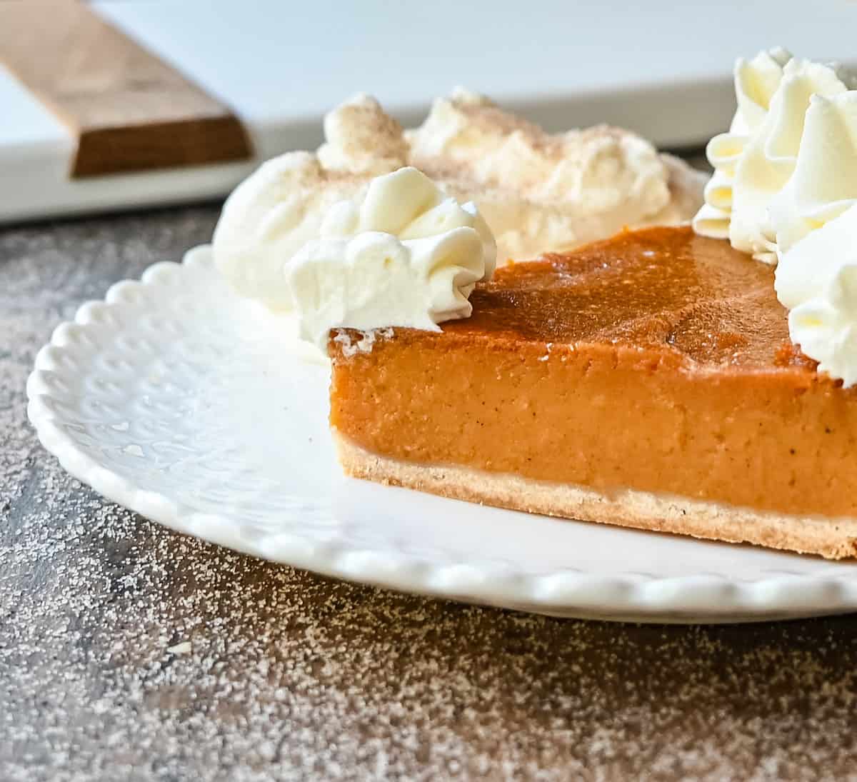 Slice of Sweet Potato Pie. This Southern Sweet Potato Pie has the creamiest, spiced brown sugar sweet potato filling in a buttery crust and topped with fresh whipped cream. This is the perfect Fall and Thanksgiving dessert.
