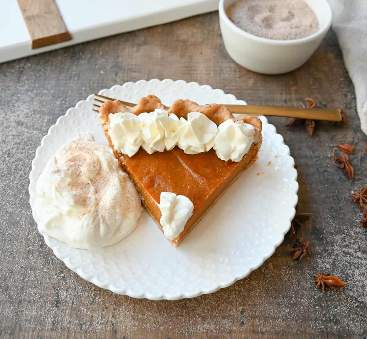 This Southern Sweet Potato Pie has the creamiest, spiced brown sugar sweet potato filling in a buttery crust and topped with fresh whipped cream. This is the perfect Fall and Thanksgiving dessert.