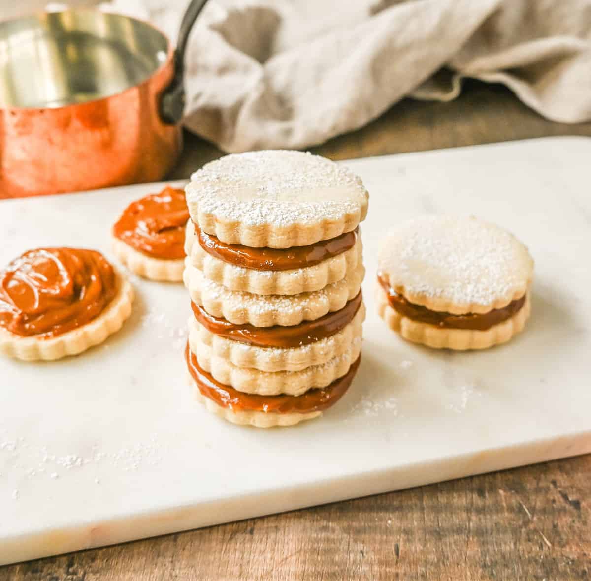 Alfajores Dulce de Leche Sandwich Cookies. These alfajores are a popular sandwich cookie around the world are made with two soft and buttery shortbread cookies filled with rich dulce de leche filling. 