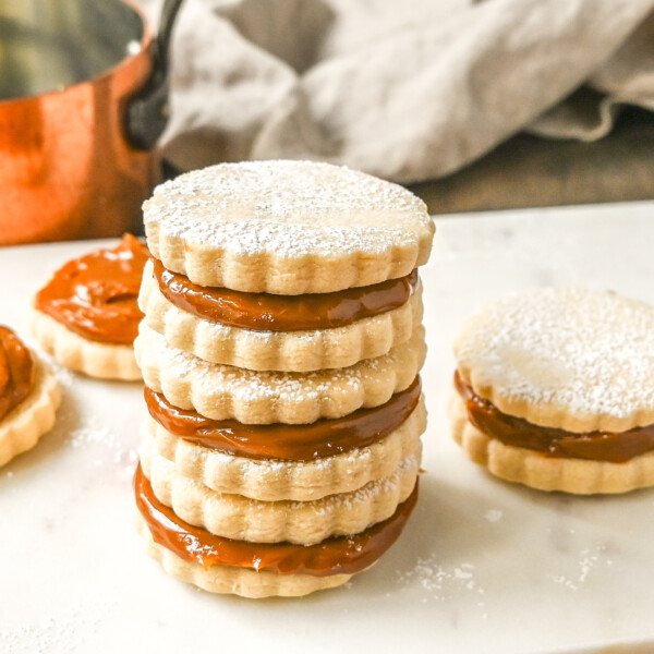 Alfajores Dulce de Leche Sandwich Cookies. These alfajores are a popular sandwich cookie around the world are made with two soft and buttery shortbread cookies filled with rich dulce de leche filling.