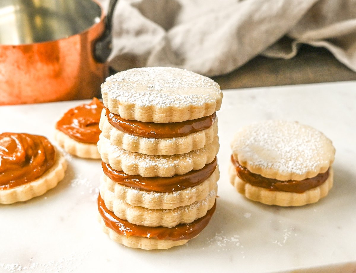 Alfajores Dulce de Leche Sandwich Cookies. These alfajores are a popular sandwich cookie around the world are made with two soft and buttery shortbread cookies filled with rich dulce de leche filling. 