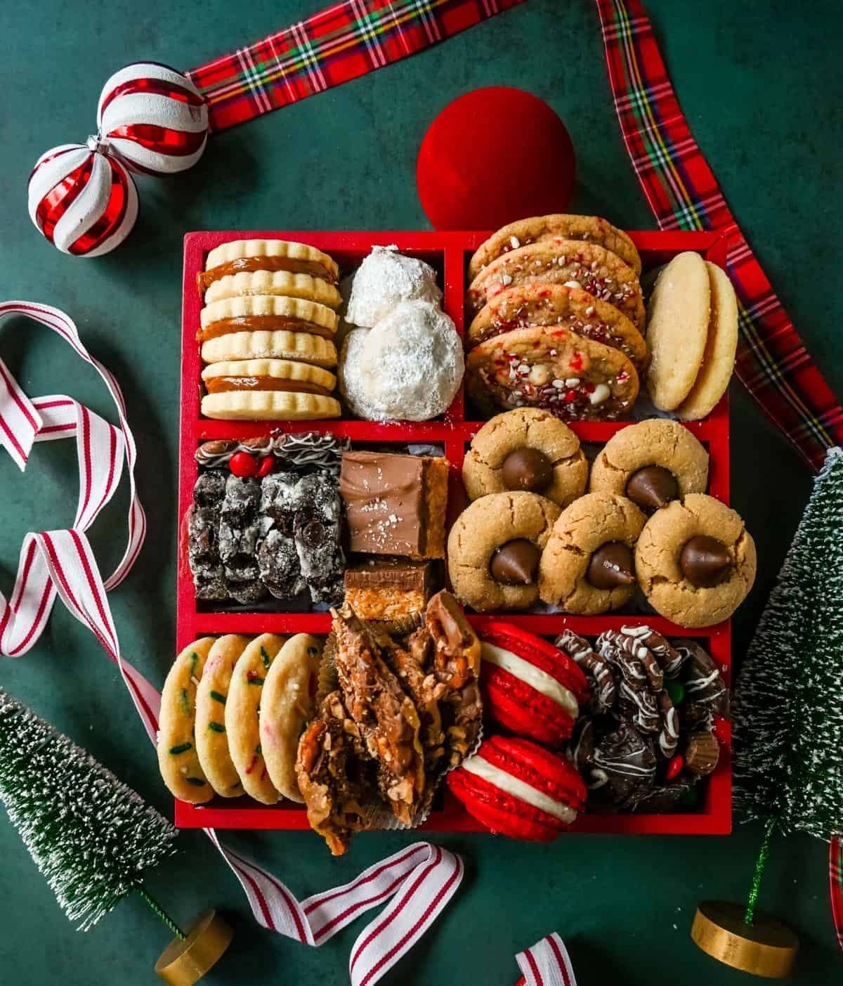 How to make a Christmas Cookie Box. Creating a Christmas cookie box is a wonderful way to spread holiday cheer and delight your friends and family with a variety of festive treats. Whether you're giving it as a gift or setting it out for guests to enjoy, a well-assembled cookie box can be a showstopper. 