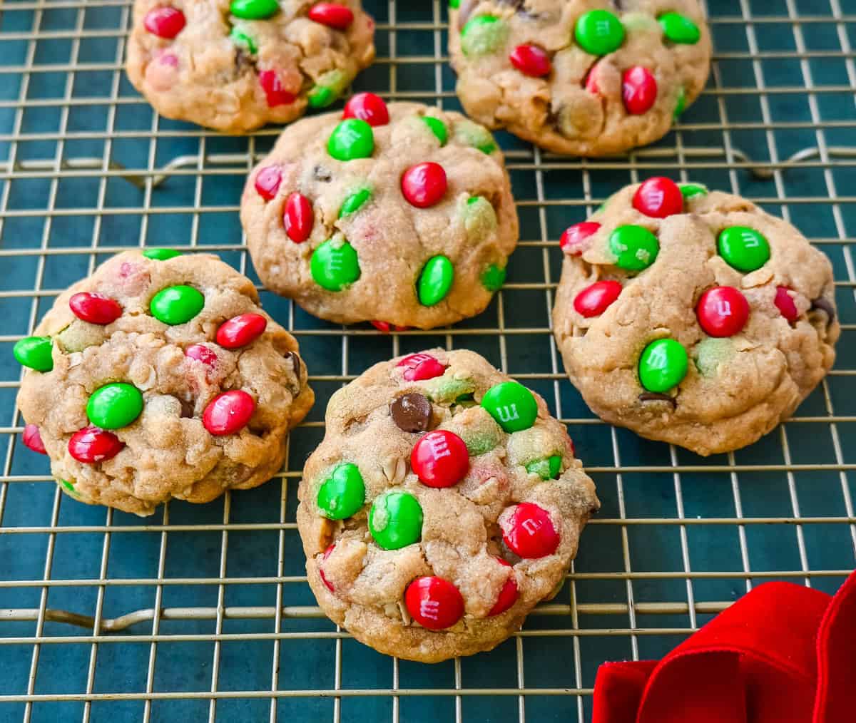 Christmas Monster Cookies. These popular, soft, thick, and chewy Christmas Monster Cookies are made with oats, peanut butter, chocolate chips, and holiday red and green M & M's. They are an easy Christmas cookie that can be made in minutes.