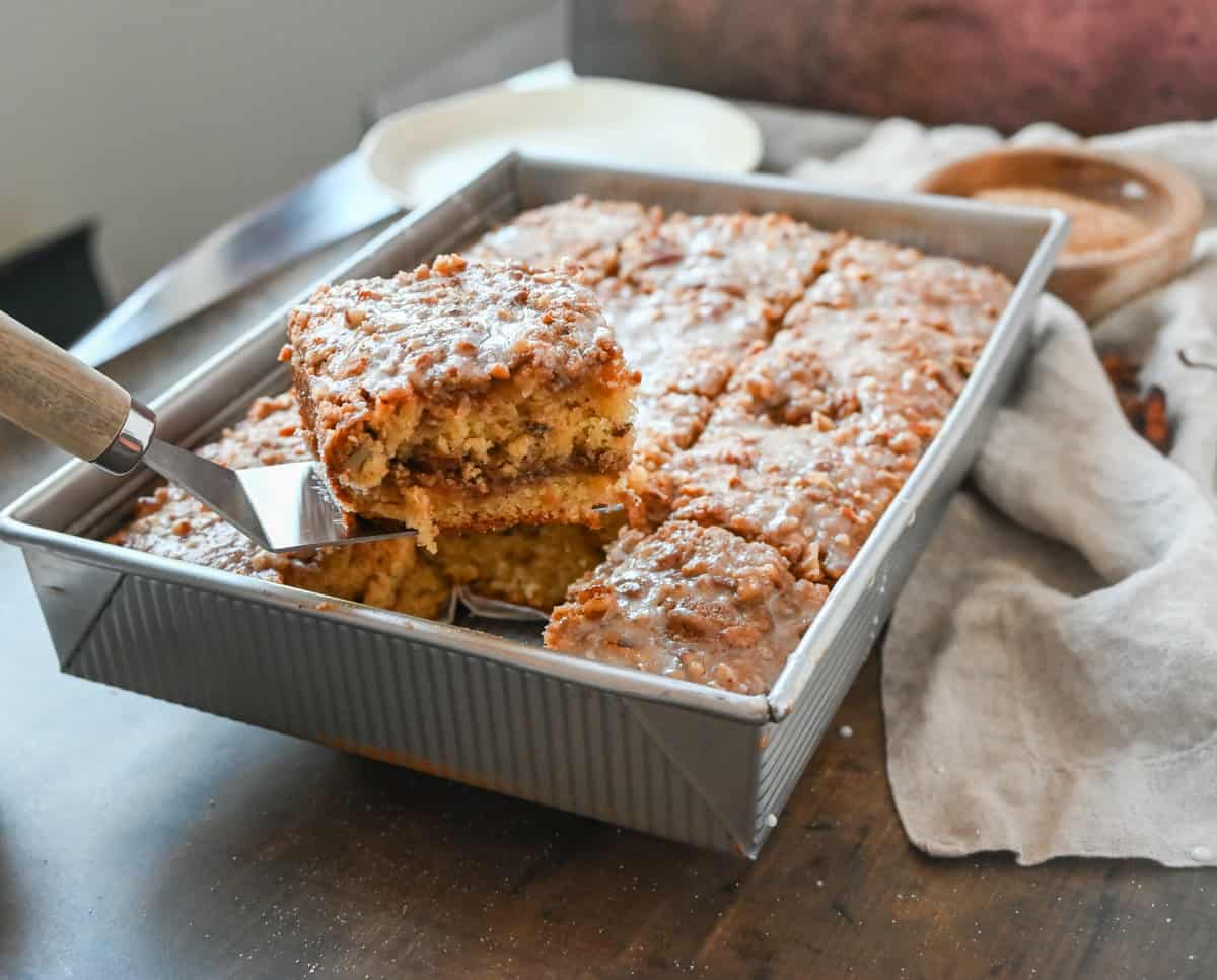 Best Coffee Cake Recipe. This cinnamon brown sugar sour cream coffee cake is made with a buttery cake layered with a brown sugar cinnamon layer and topped with a streusel topping and a sweet glaze. The best coffee cake recipe perfect for breakfast or brunch.