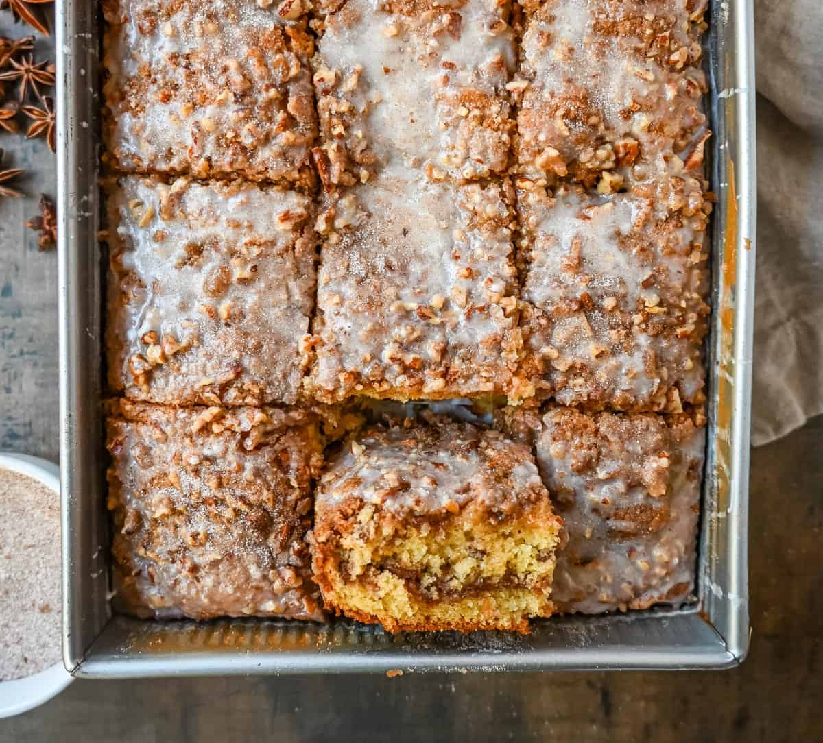 Best Coffee Cake Recipe. This cinnamon brown sugar sour cream coffee cake is made with a buttery cake layered with a brown sugar cinnamon layer and topped with a streusel topping and a sweet glaze. The best coffee cake recipe perfect for breakfast or brunch.