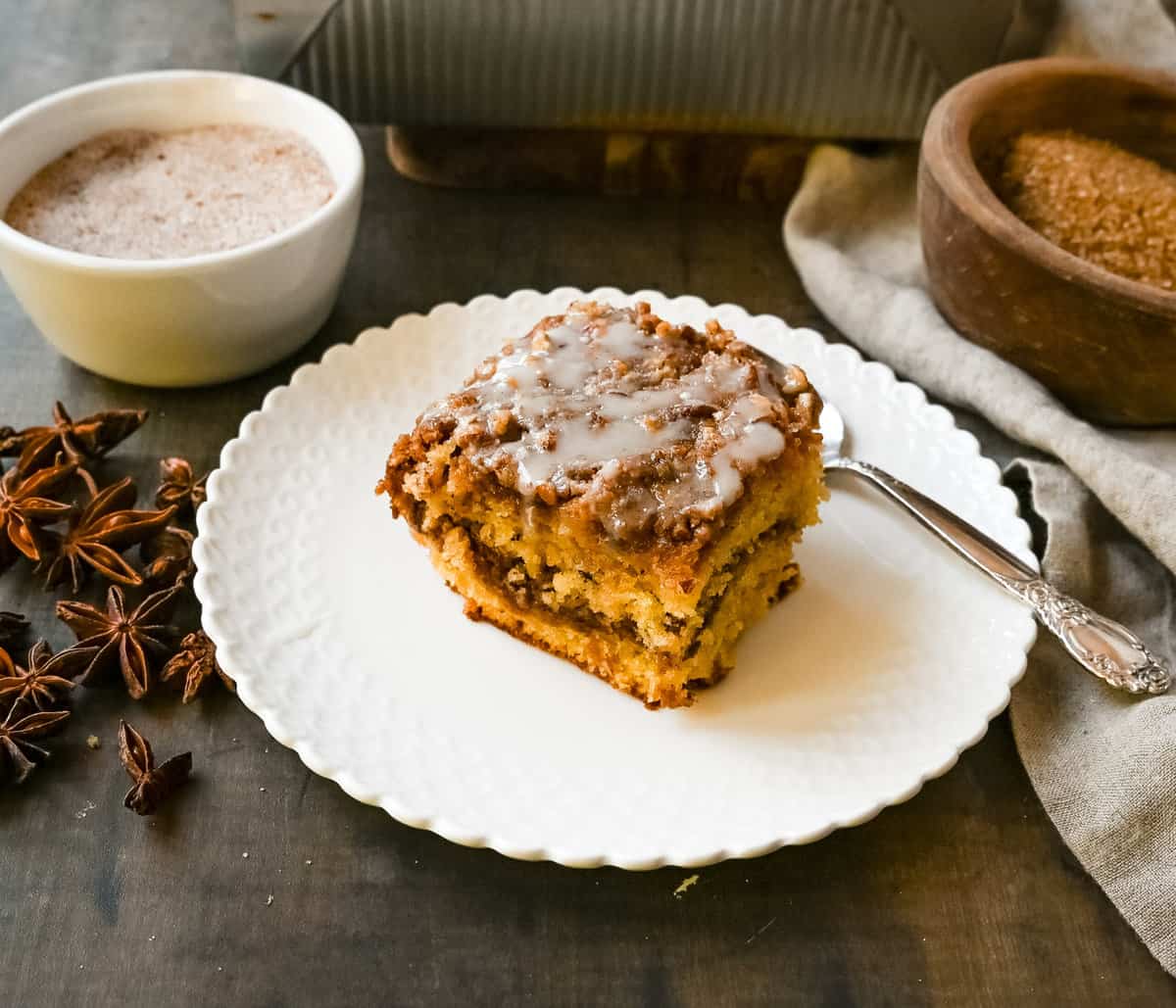 Best Coffee Cake Recipe. This cinnamon brown sugar sour cream coffee cake is made with a buttery cake layered with a brown sugar cinnamon layer and topped with a streusel topping and a sweet glaze. The best coffee cake recipe perfect for breakfast or brunch.