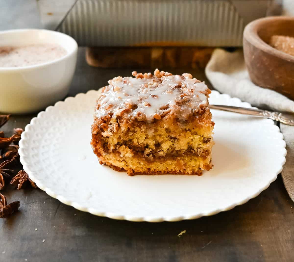 Best Coffee Cake Recipe. This cinnamon brown sugar sour cream coffee cake is made with a buttery cake layered with a brown sugar cinnamon layer and topped with a streusel topping and a sweet glaze. The best coffee cake recipe perfect for breakfast or brunch.