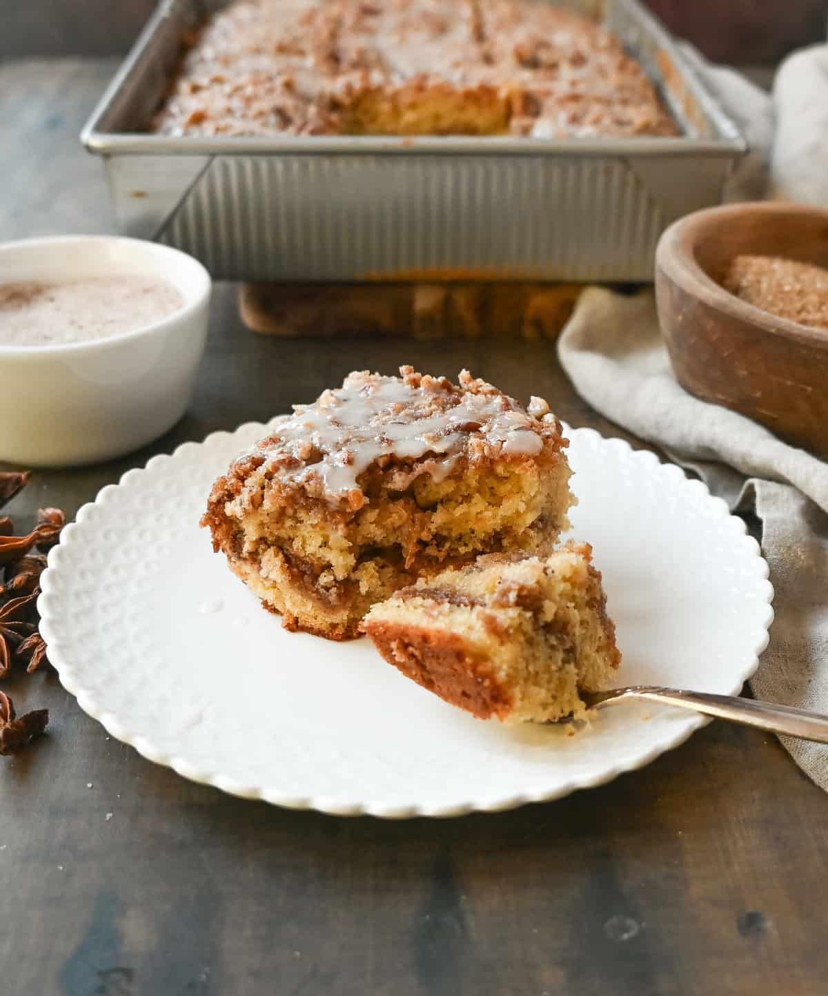 Best Coffee Cake Recipe. This cinnamon brown sugar sour cream coffee cake is made with a buttery cake layered with a brown sugar cinnamon layer and topped with a streusel topping and a sweet glaze. The best coffee cake recipe perfect for breakfast or brunch.