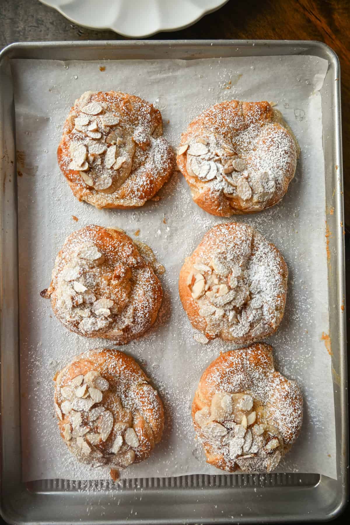 Easy Almond Croissants. How to make the easiest homemade almond croissants ever! These buttery, flaky croissants filled with a homemade almond filling and topped with crunchy almonds will rival any bakery. You can make these bakery-style almond croissants in 25 minutes!