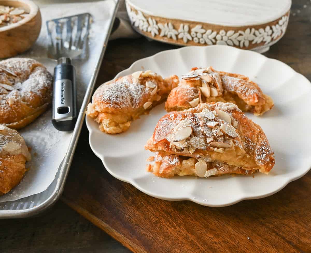 Easy Almond Croissants. How to make the easiest homemade almond croissants ever! These buttery, flaky croissants filled with a homemade almond filling and topped with crunchy almonds will rival any bakery. You can make these bakery-style almond croissants in 25 minutes!