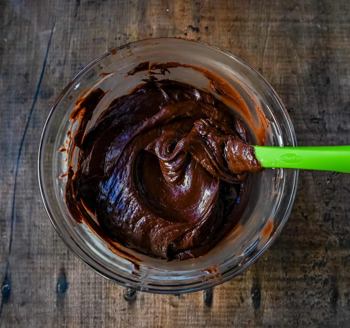Mixing the chocolate and sweetened condensed milk in a microwave safe bowl