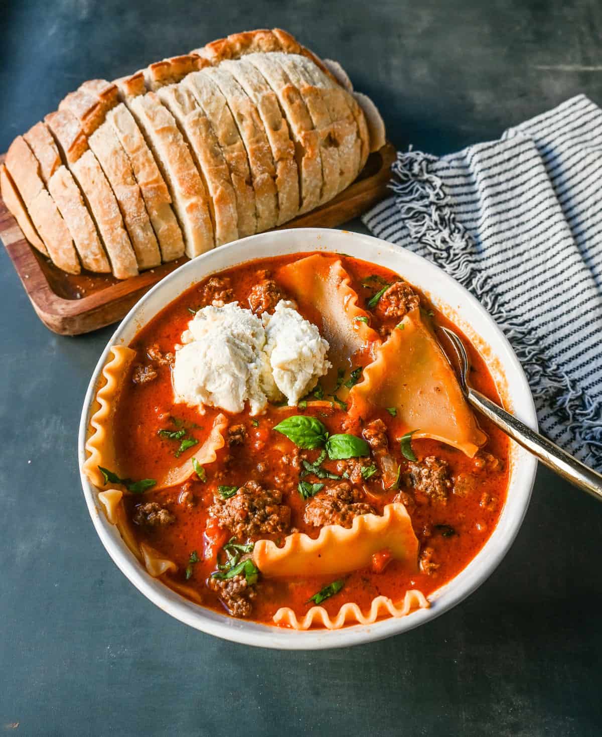 The viral Tik Tok Lasagna Soup! A hearty beef lasagna soup with fresh ricotta cheese, mozzarella, parmesan cheese, and fresh herbs. An Italian classic recipe made into a comforting soup! This is the best lasagna soup recipe!