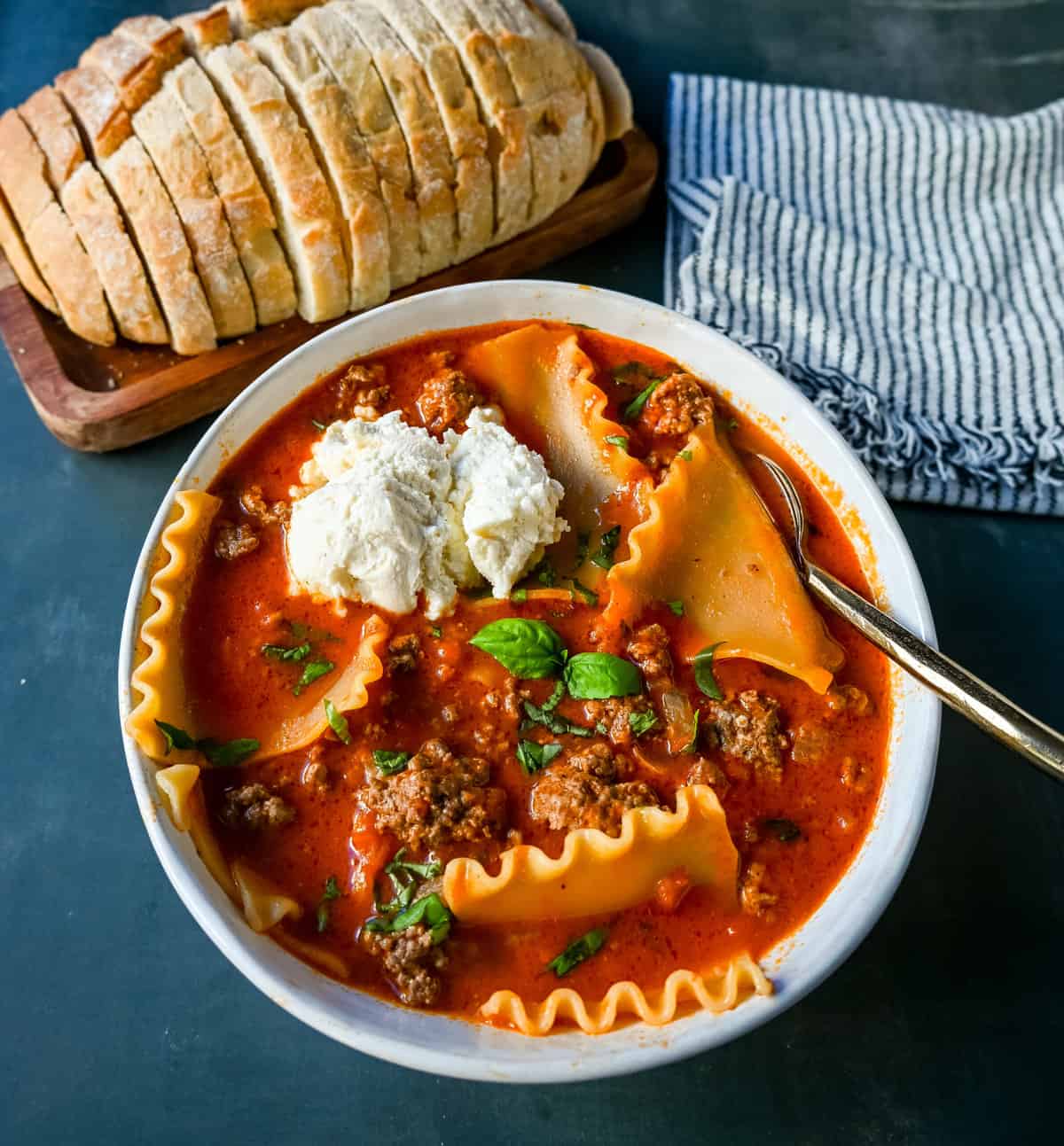 The viral Tik Tok Lasagna Soup! A hearty beef lasagna soup with fresh ricotta cheese, mozzarella, parmesan cheese, and fresh herbs. An Italian classic recipe made into a comforting soup! This is the best lasagna soup recipe!