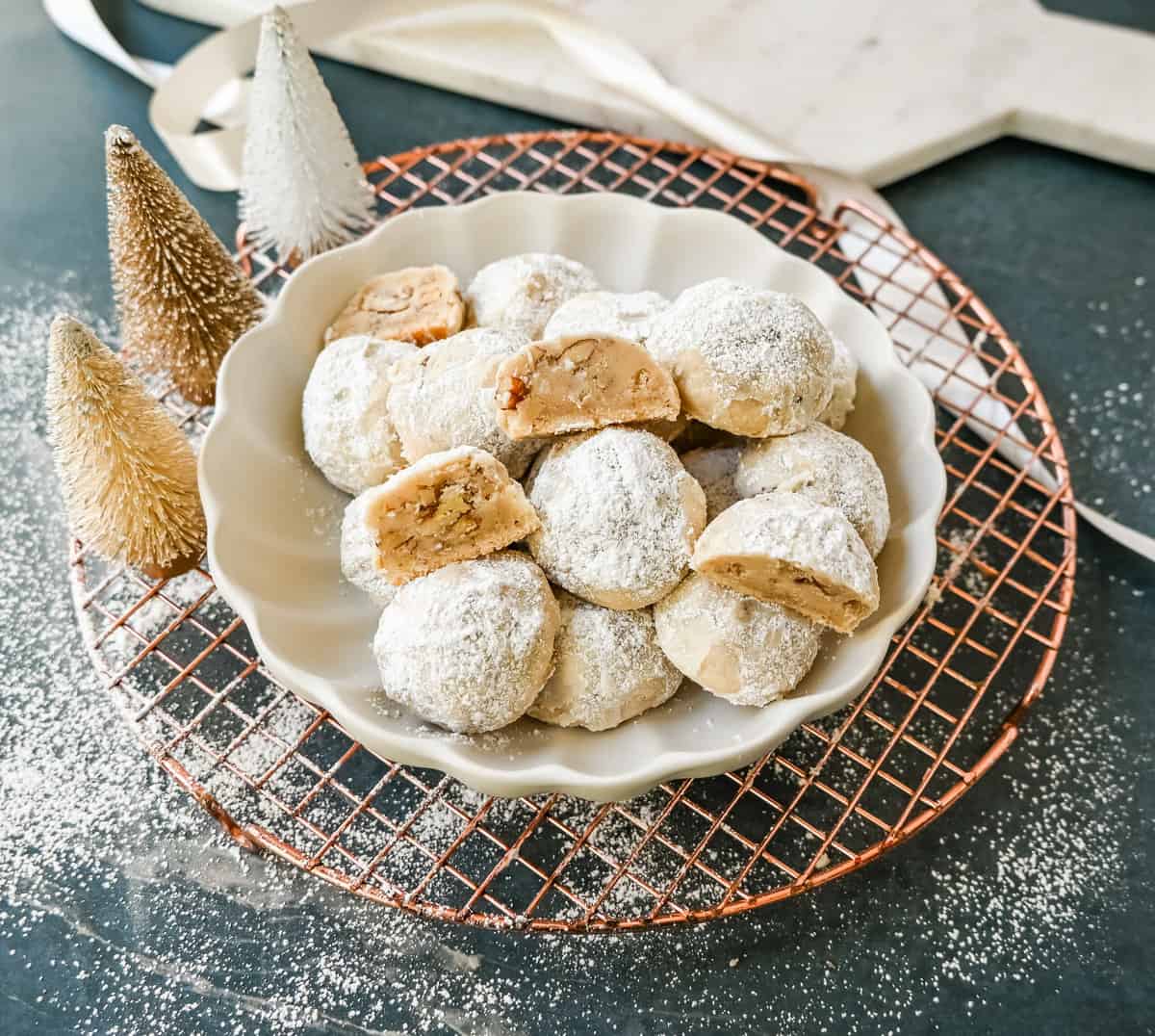 Mexican Wedding Cookies (Snowball Cookies). These buttery, nutty, Mexican wedding cookies are so easy to make and call for only 5 ingredients. These melt-in-your-mouth cookies are perfect to make during the holidays and everyone loves them. The perfect Christmas cookie recipe. A festive Christmas cookie.