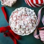 Peppermint Puppy Chow, also known as Peppermint Muddy Buddies, Peppermint Chex Mix, or Peppermint Bark Muddy Buddies, is a festive and addictive holiday treat. It is a variation of the classic Muddy Buddies, but is made with Rice Chex cereal, white chocolate, peppermint bark or candy canes, and powdered sugar.