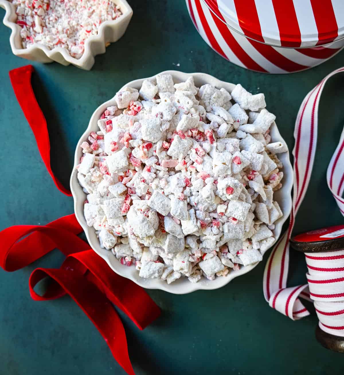 Peppermint Puppy Chow, also known as Peppermint Muddy Buddies, Peppermint Chex Mix, or Peppermint Bark Muddy Buddies, is a festive and addictive holiday treat. It is a variation of the classic Muddy Buddies, but is made with Rice Chex cereal, white chocolate, peppermint bark or candy canes, and powdered sugar. 