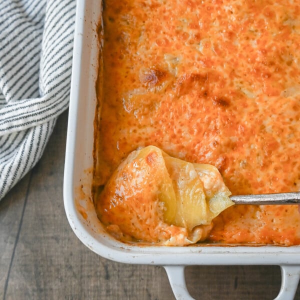 Cheesy Scalloped Potatoes. These creamy, cheesy scalloped potatoes are the perfect side dish and are made with thinly sliced potatoes, a decadent bechamel sauce, and layers upon layers of cheese and baked until melted and bubbly.