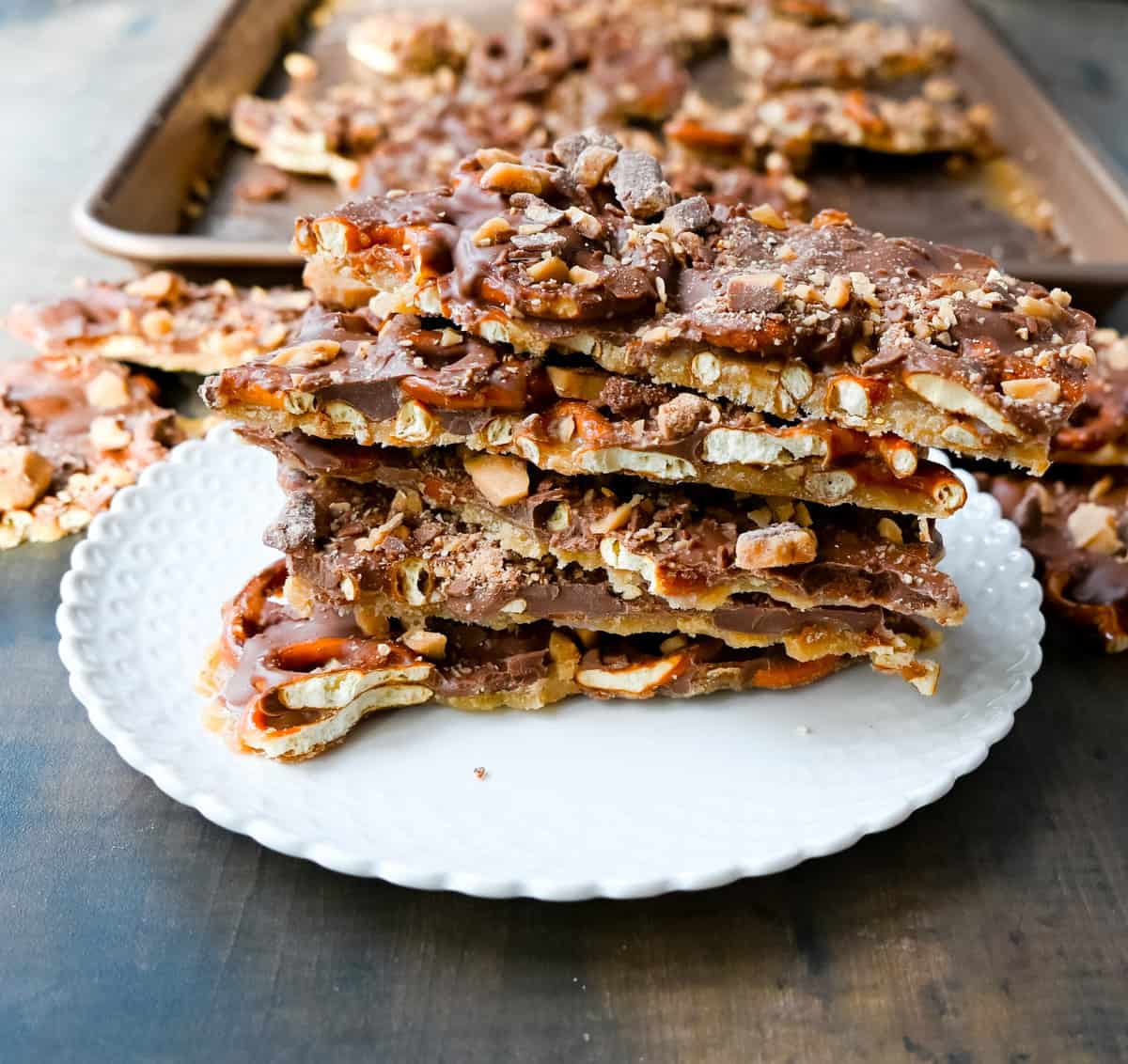 Toffee Pretzel Christmas Crack. This is Christmas Crack but even better! This homemade chocolate toffee bark is made with crunchy pretzels, soft buttery toffee, rich chocolate, and Heath bar chocolate toffee bits. This is a super easy Christmas crack recipe and perfect to share around the holidays.