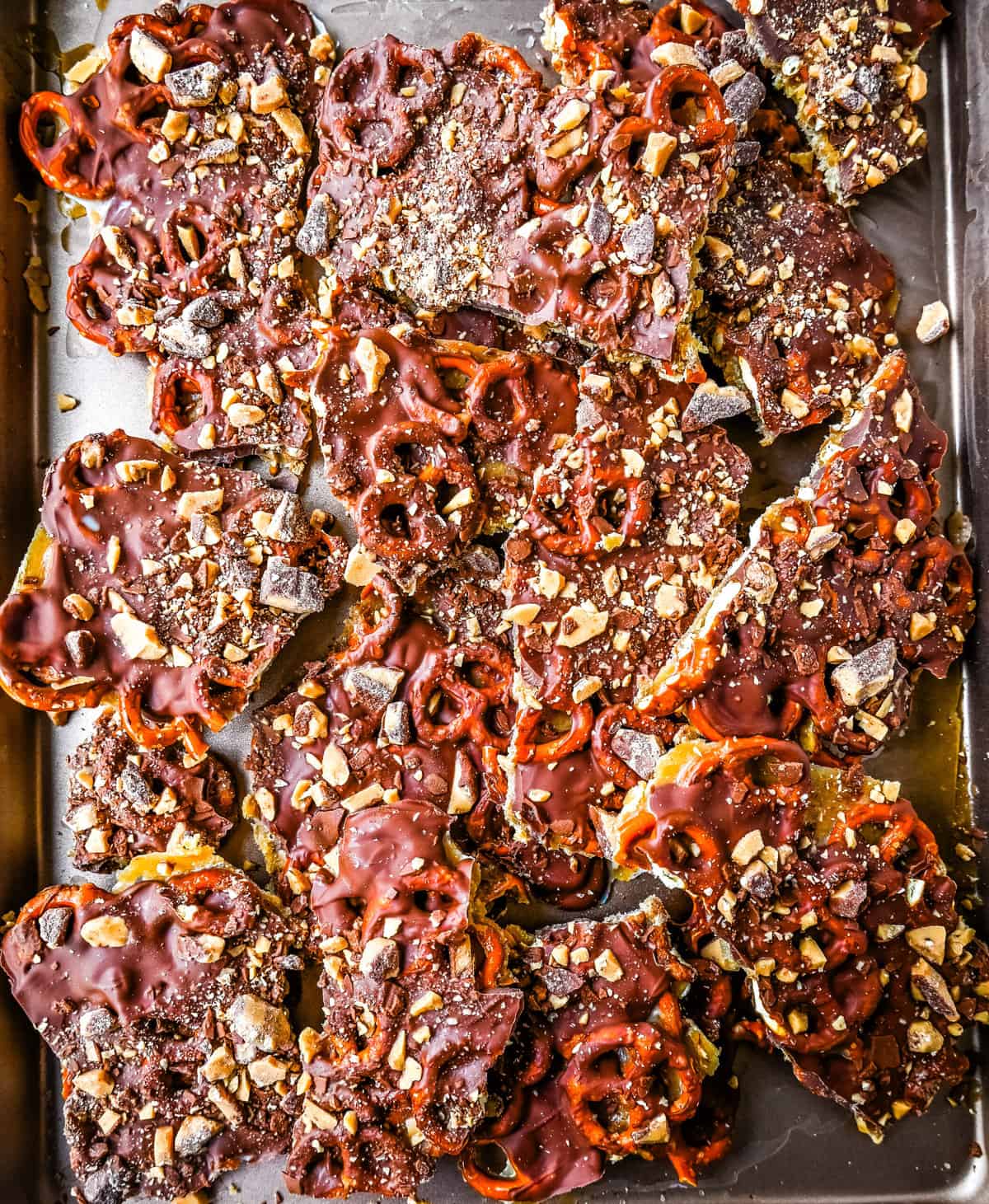 Toffee Pretzel Christmas Crack. This is Christmas Crack but even better! This homemade chocolate toffee bark is made with crunchy pretzels, soft buttery toffee, rich chocolate, and Heath bar chocolate toffee bits. This is a super easy Christmas crack recipe and perfect to share around the holidays.