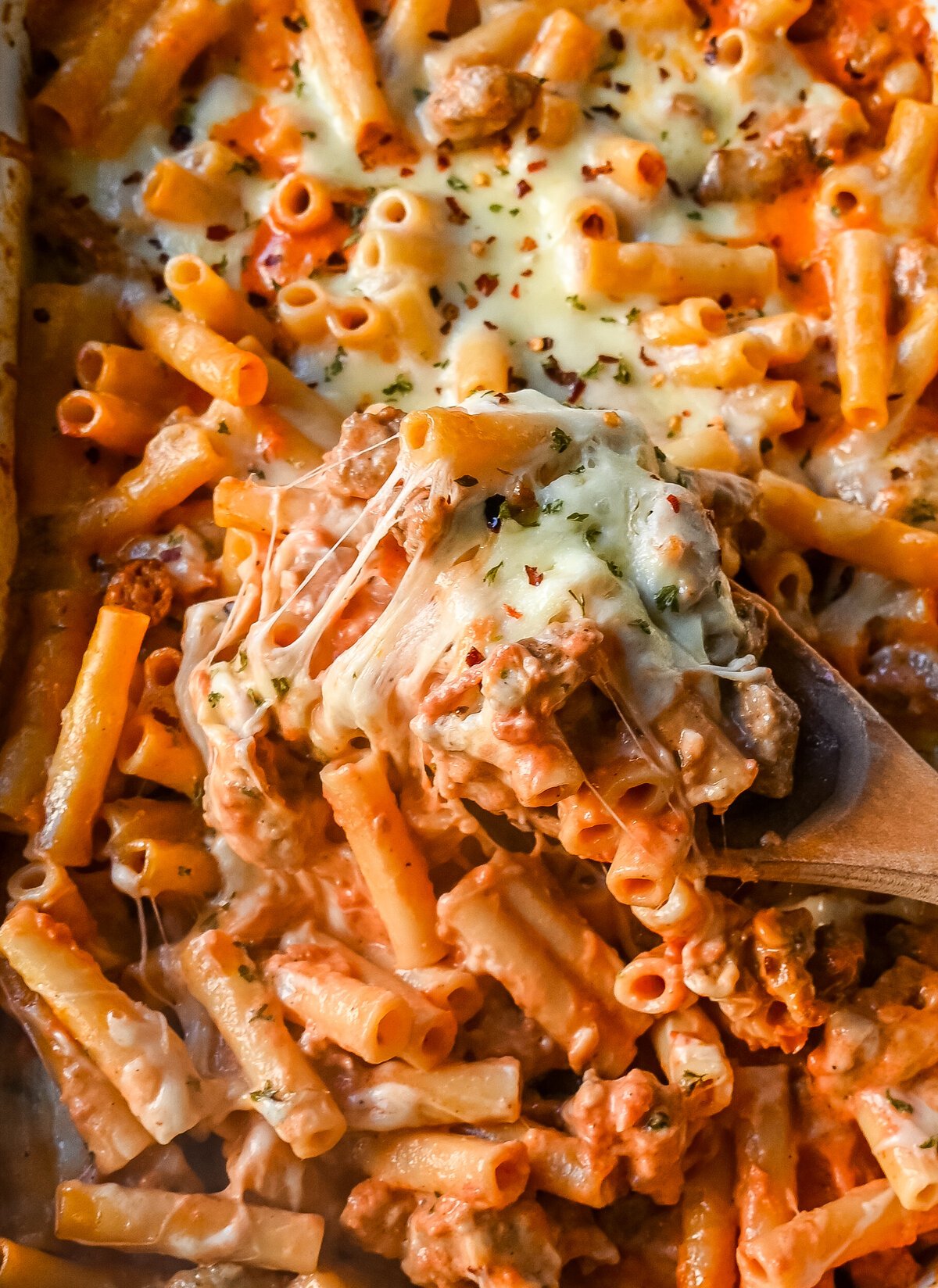 This Baked Ziti Pasta is made with ziti noodles, sausage, marinara sauce, fresh basil, spices, whole milk mozzarella cheese, parmesan cheese, and heavy cream and baked until the cheese is melted. The best-baked ziti recipe! This is a perfect recipe to freeze or make ahead of time.