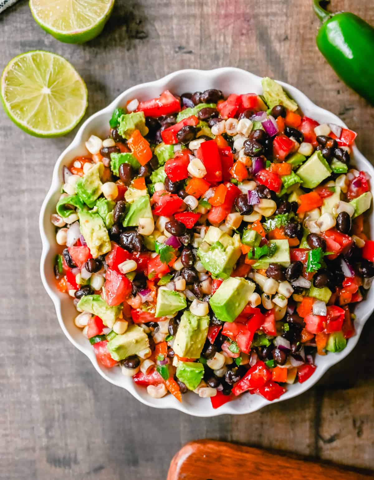 Cowboy Caviar. A popular, crowd-pleasing, fresh salsa appetizer made with black beans, corn, tomatoes, cilantro, avocado, peppers, all tossed in a zesty dressing. 