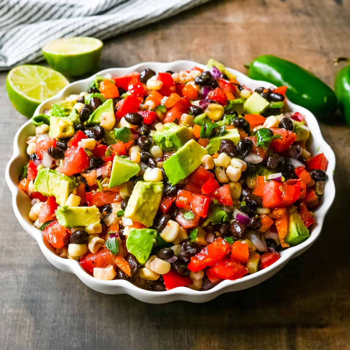 Cowboy Caviar. A popular, crowd-pleasing, fresh salsa appetizer made with black beans, corn, tomatoes, cilantro, avocado, peppers, all tossed in a zesty dressing. 