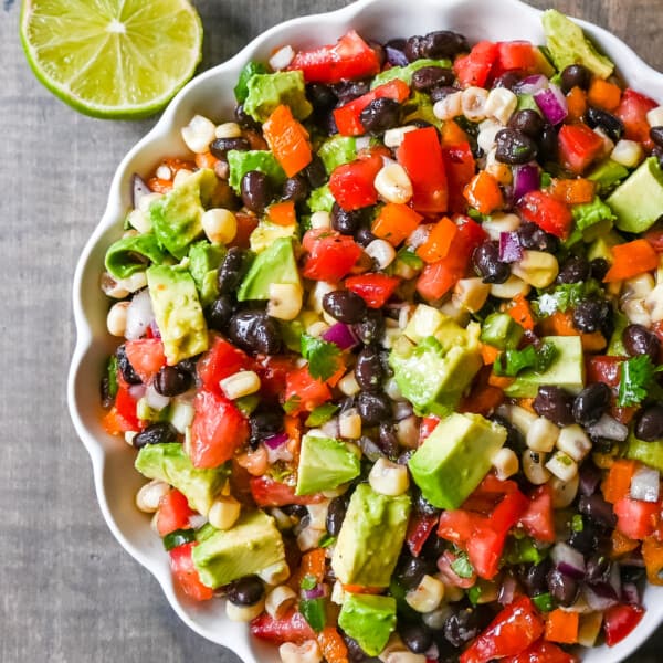 Cowboy Caviar. A popular, crowd-pleasing, fresh salsa appetizer made with black beans, corn, tomatoes, cilantro, avocado, peppers, all tossed in a zesty dressing. 