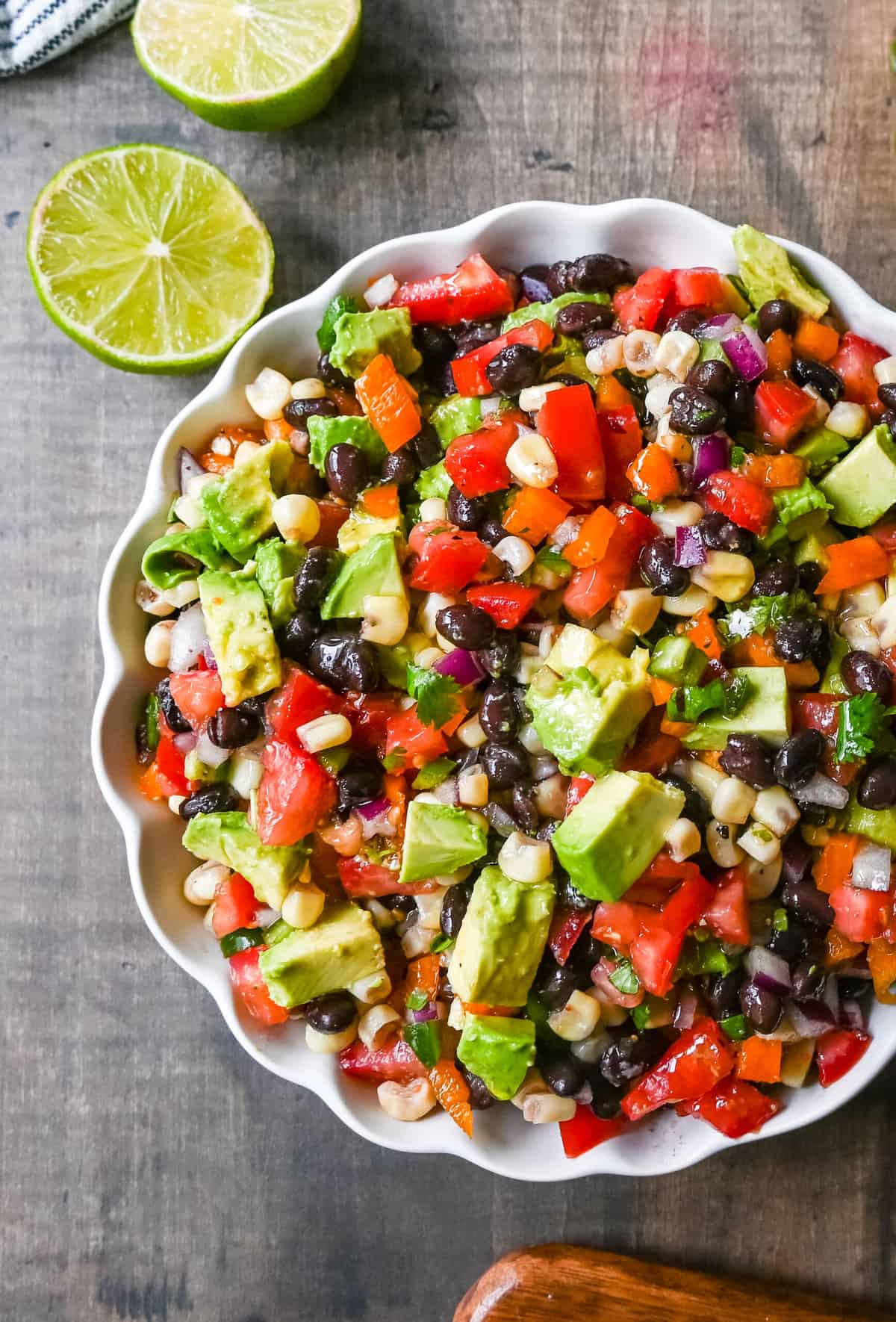 Cowboy Caviar. A popular, crowd-pleasing, fresh salsa appetizer made with black beans, corn, tomatoes, cilantro, avocado, peppers, all tossed in a zesty dressing. 