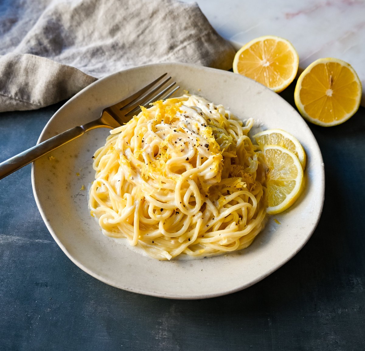 Lemon Pasta (Spaghetti al Limone). This creamy and tangy pasta dish features fresh lemon cream sauce tossed with fresh pasta. This Spaghetti al Limone is vibrant, fresh, and perfectly creamy and is so easy to make!