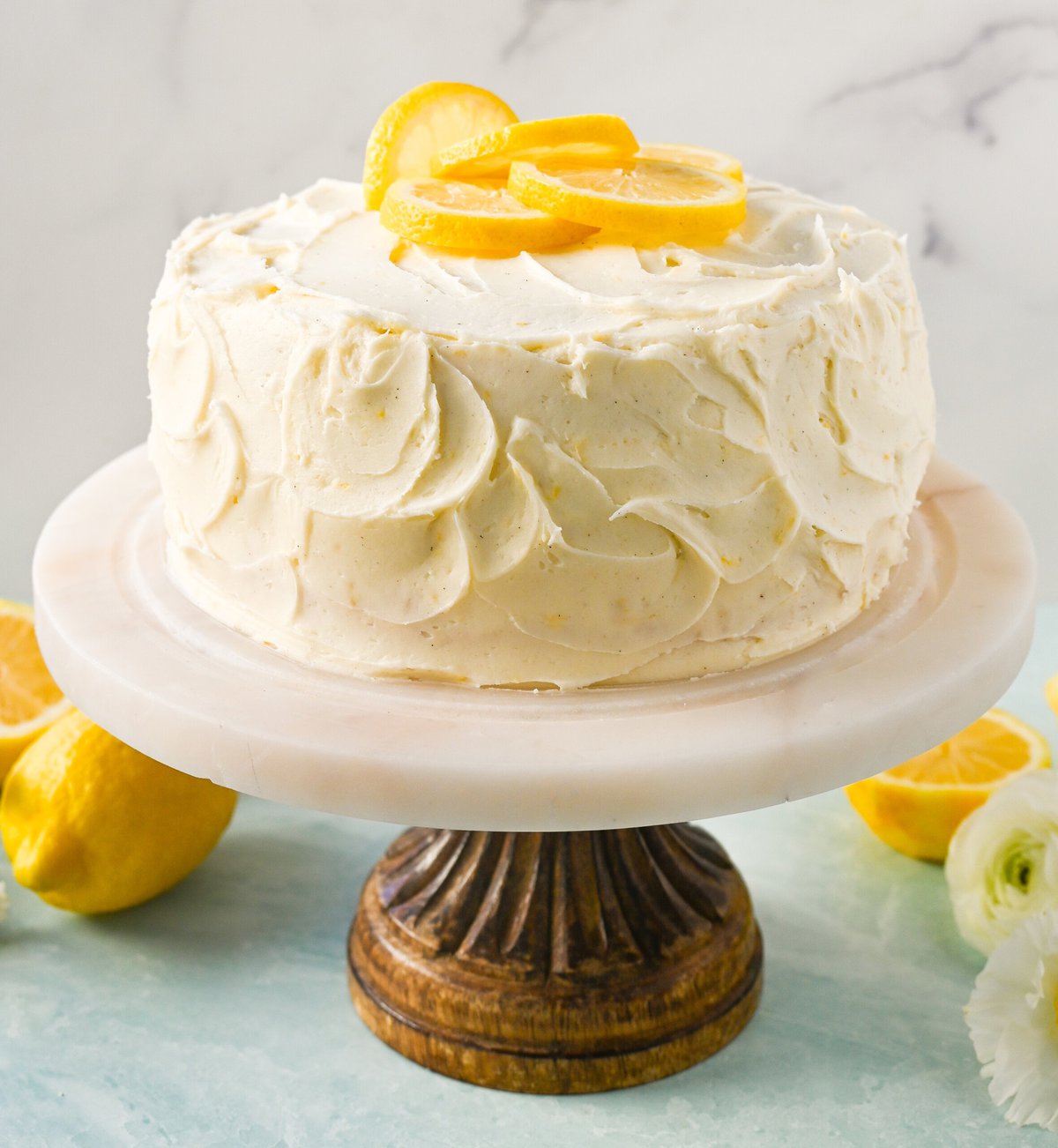 The Best Lemon Cake Recipe is moist, light, and fluffy made with fresh lemon juice and layered with lemon curd and lemon cream cheese frosting. This is the lemon cake of your dreams!
