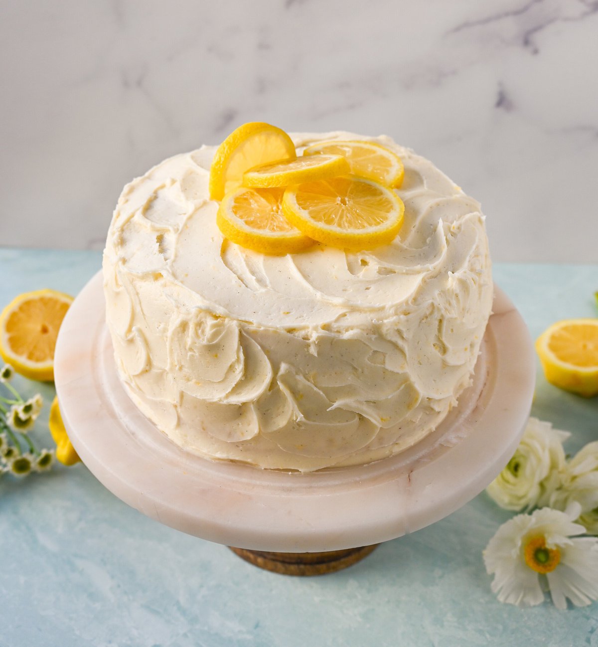 The Best Lemon Cake Recipe is moist, light, and fluffy made with fresh lemon juice and layered with lemon curd and lemon cream cheese frosting. This is the lemon cake of your dreams!