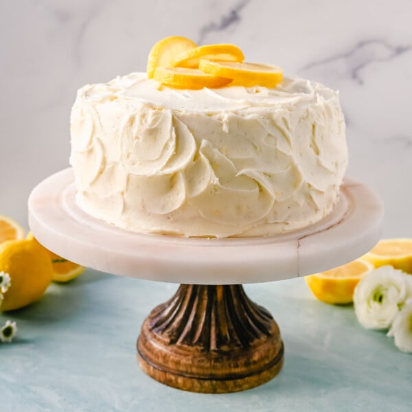 The Best Lemon Cake Recipe is moist, light, and fluffy made with fresh lemon juice and layered with lemon curd and lemon cream cheese frosting. This is the lemon cake of your dreams!